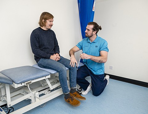 Testing reflexes with physiotherapist
